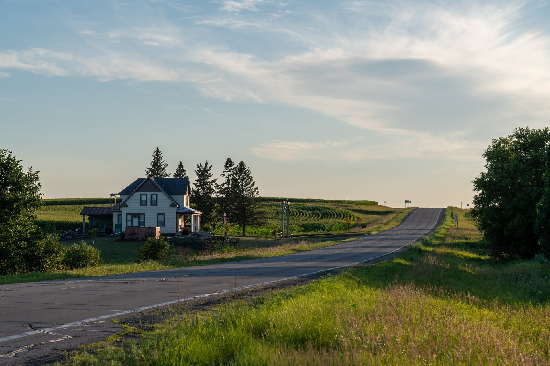Rural Texas county road through ranch land