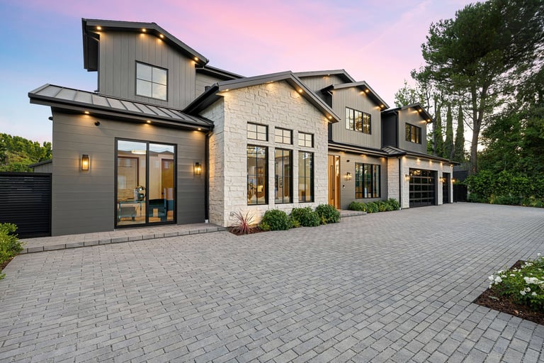 Modern luxury home with freshly paved smooth asphalt driveway