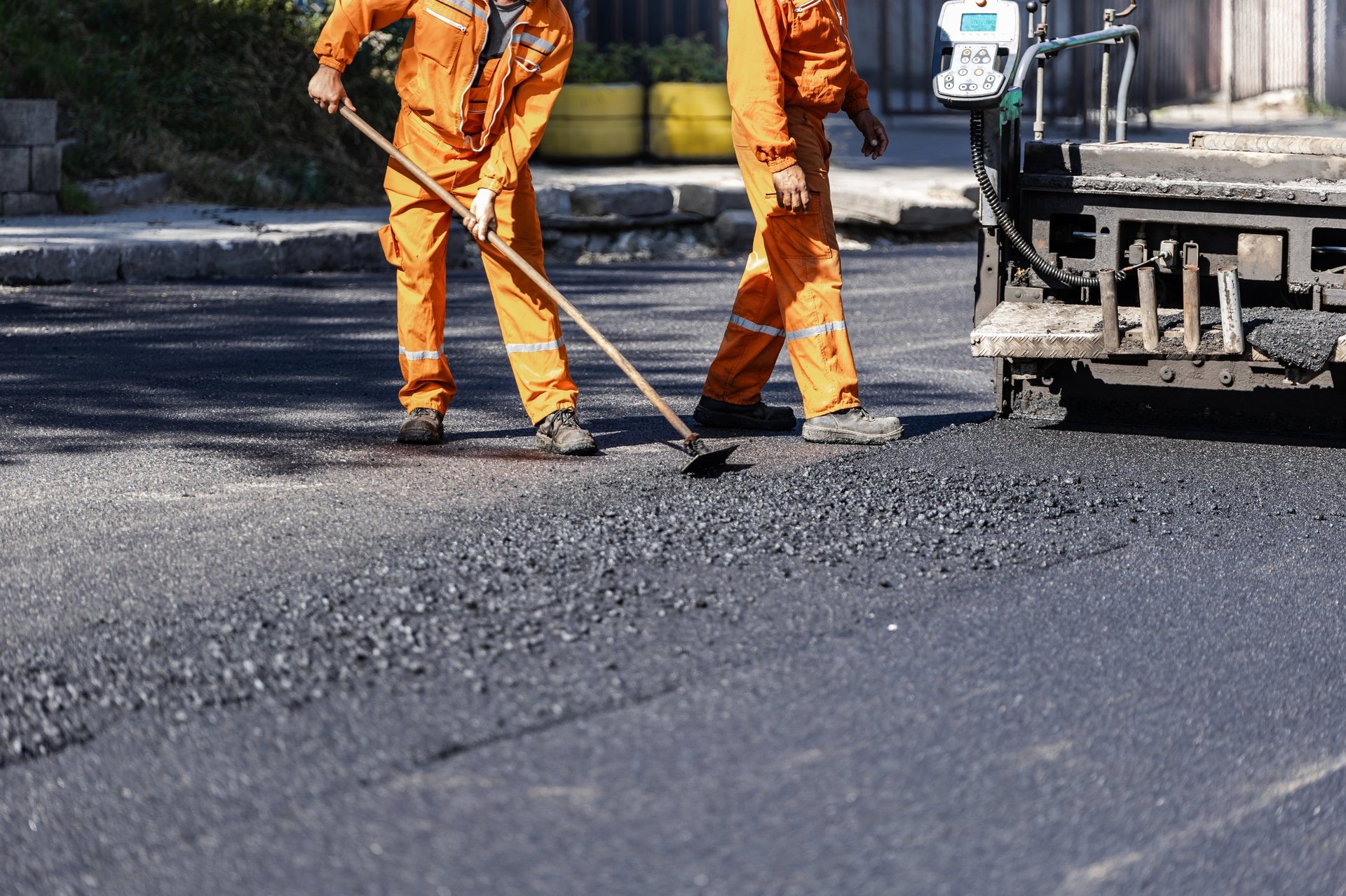 Professional paving crew laying fresh asphalt in Austin, TX